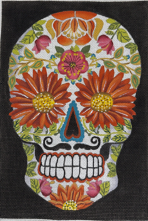 Colorful sugar skull design with flowers and leaves on a black background