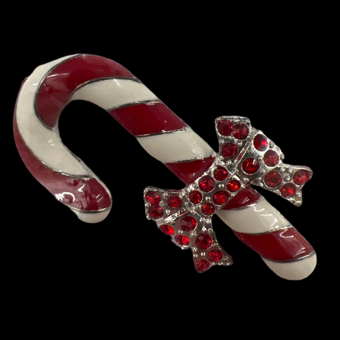 Candy cane-shaped needle minder with a red bow and rhinestones with a  magnet